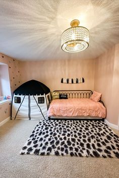 a bedroom with a bed, rug and other items in the room on the floor