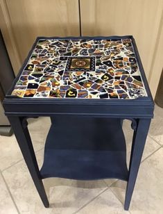 a blue table with a mosaic design on it