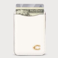 Crafted with genuine Italian leather and finished with Coach’s Signature hardware, this magnetic card case holds up to two cards and cash with thoughtfully designed cutouts to easily remove your essentials. Bring luxury to your everyday accessory with built-in magnets that snap on and off of your phone case. Coach Card Wallet, Coach Phone Case, Tree Hunt, Travel Tech Organizer, Dance Team Gifts, Magsafe Wallet, Wallet Cute, Gift Wishlist, Waterproof Dry Bag