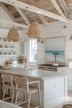 a kitchen with an island and wicker chairs