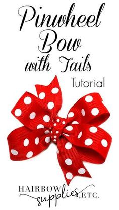 a red and white polka dot bow with tails