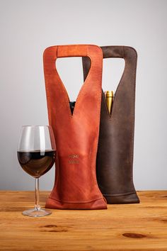 a wine bottle and glass holder sitting next to each other