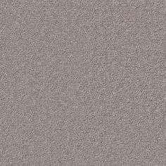 a close up view of the surface of a gray carpet with small dots on it