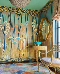 a room with colorful wallpaper and a chair in front of a mirror on the wall