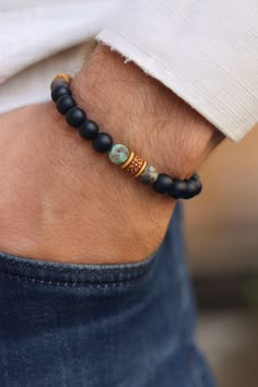 Matte Black Onyx and Tibetan Agate , Balance Bracelet, Mens Bracelet, Stretch Bracelet, Gemstone Bracelet, Healing Bracelet,Men gifts    Matte Black onyx is a powerful protection stone that absorbs and transforms negative energy, and helps to prevent the drain of personal energy. Black onyx aids the development of emotional and physical strength and stamina, expecially when support is needed during times of stress, confusion or grief.  Tibetan Agate -  Highly regarded as a talisman since ancient Handmade Mens Jewelry, Men Gemstone Bracelet, Custom Beaded Bracelets, Stone Bracelet For Men, Stone Beads Bracelets, Men’s Bracelet Designs, Male Bracelets, Mens Bracelet Diy, Mens Stretch Bracelets