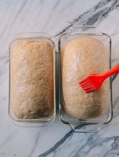 two loafs of oatmeal sitting next to each other on a marble counter