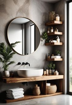 a bathroom with a sink, mirror and shelves on the wall next to a window