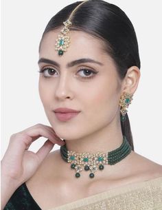 This Jewellery Set Is Crafted In Gold Plating And Consists Of A Necklace, Maang Tikka And A Pair Of Earrings.The Choker Necklace Feature Kundan Studded In It And Is Secured With A Drawstring Closures. Style This Necklace Set With A Saree Or A Salwar Suit To Enhance The Look.This Jewelry Set Is A Great Option And A Perfect Pick For Your Wedding Functions. Luxurious Jewellery With High End Be Assured To Find A Variety Of Contemporary And Traditional Designs In The Mesmerizing Collection That We Of Festive Kundan Necklace With Zari Work For Parties, Kundan Party Necklace, Kundan Necklace For Party, Kundan Choker For Party, Bollywood Kundan Party Choker, Bollywood Kundan Choker For Party, Temple Jewelry Choker For Diwali Party, Festive Beaded Choker, Kundan Beaded Choker For Parties