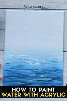 someone holding up a painting with the words how to paint water with acrylic