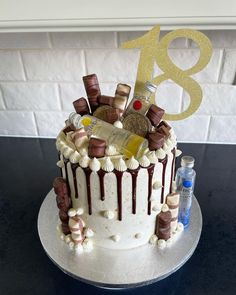 a birthday cake decorated with chocolate and champagne