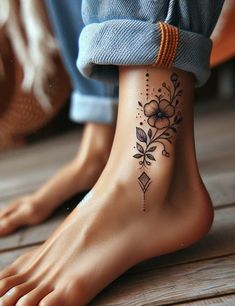 a person with a flower tattoo on their foot