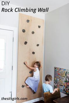 two children climbing up the side of a wall with text overlay that reads diy rock climbing wall