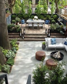 an outdoor patio with seating and trees