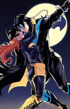 an image of a catwoman kissing a man in front of the moon