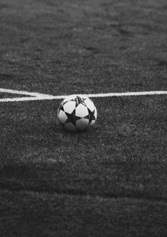 a black and white photo of a soccer ball