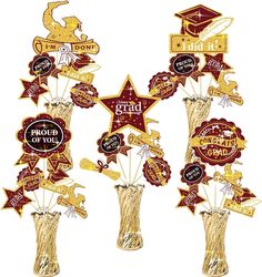 three vases filled with gold and red graduation decorations