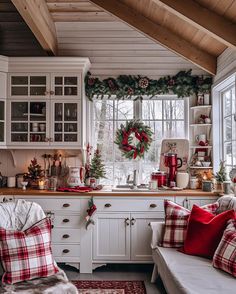 a kitchen decorated for christmas with red and green decorations