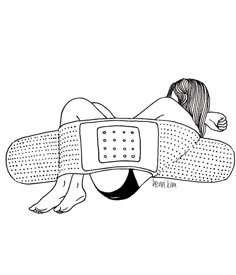 a woman laying on top of a pillow with an electronic device attached to her back