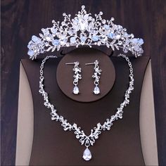 a tiara and earrings on display in a box