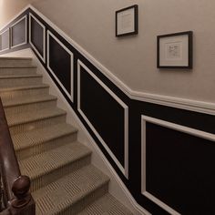 there is a staircase with black and white walls