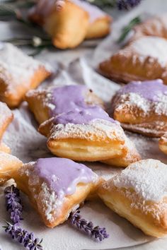 lavender pastries on a plate with lavender sprigs