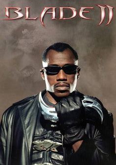 a man in black leather jacket and sunglasses