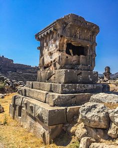 an ancient structure in the middle of some rocks