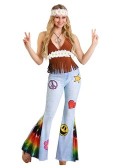 a woman in a hippie outfit with peace signs and other symbols on her chest