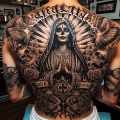 a man with tattoos on his back and chest