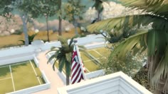 an aerial view of a tennis court and palm trees in the foreground, with a flag on top