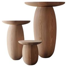 three wooden vases sitting next to each other