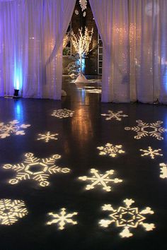 a decorated dance floor with snowflakes on it