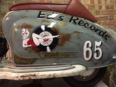 an old motorcycle with the words e s records painted on it