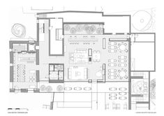 the floor plan for a restaurant with tables and chairs, couches, and kitchen