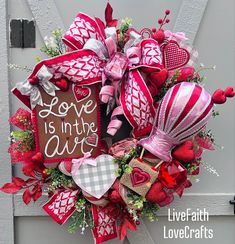 a valentine's day wreath with love is in the air