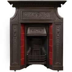 an antique fireplace with ornate carvings and red painted paint on the walls, in front of a white background