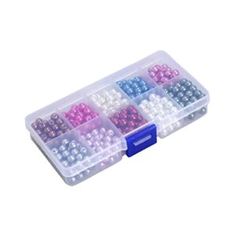 a plastic box filled with lots of different colored beads