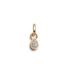 a gold charm with diamonds on it