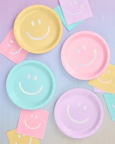 colorful paper plates with smiley faces on them