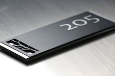 a close up of a metal surface with the number 205 on it