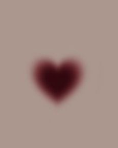 a red heart shaped object in the middle of a gray background with an area for text