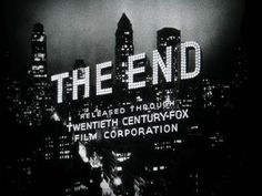 the end title screen with city lights in the background and text on it