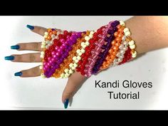 a woman's hand with colorful beads on it