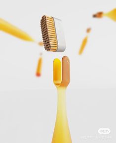 a yellow toothbrush is flying through the air