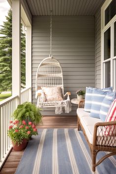 a porch with chairs and a birdcage on it