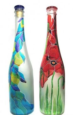 two glass bottles with different designs on them