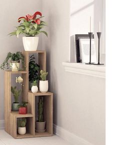 three wooden shelves with plants in them on the floor