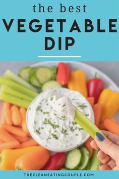 the best veggie dip is in a white bowl with carrots and celery