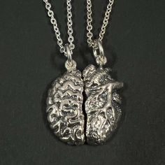 Are you looking for a gift that is worth giving to the couple? Discover the Anatomical Heart & Human Brain Necklace. It's a perfect gift for couples who wants a unique piece of jewelry that is different from others. Base Material: 925 Sterling Silver  Size: 20mm X 23mm Chain Length: 16'' - 24'' Inches (Selectable) Metal Stamped: 925 Thickness: 1.5mm / 0.059 Inch You'll receive an Order Shipped Email from us when your item is completed and shipped. SPECIAL ANNOUNCEMENT  1. Please visit https://www.etsy.com/shop/yhtanaff for more designs. 2. Subscribe to our newsletter to receive a Coupon Code for a 10% discount.      URL: http://eepurl.com/coVNqn 3. Please LIKE our Facebook Fan Page: URL:  https://www.facebook.com/HandmadeSilverJewelryByYhtanAff Brain Necklace, Medical Graduation, Anatomy Heart, Heart Brain, Facebook Fan Page, Anatomical Heart, Gift For Couples, Human Brain, Husband And Wife