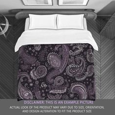 an image of a bed with a purple paisley comforter set on it and the words, disclair this is an example picture